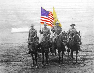 Buffalo Soldiers - This is a 10th Cavalry Color Guard, probably photographed in 1917 or 1918. The uniforms are in transition but the blue and gold have been replaced by olive drab.